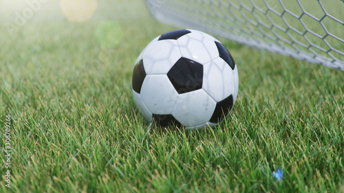 3D illustration Soccer ball flew into the goal. Soccer ball bends the net, against the background of grass. Soccer ball in goal net on grass background. A moment of delight © rost9