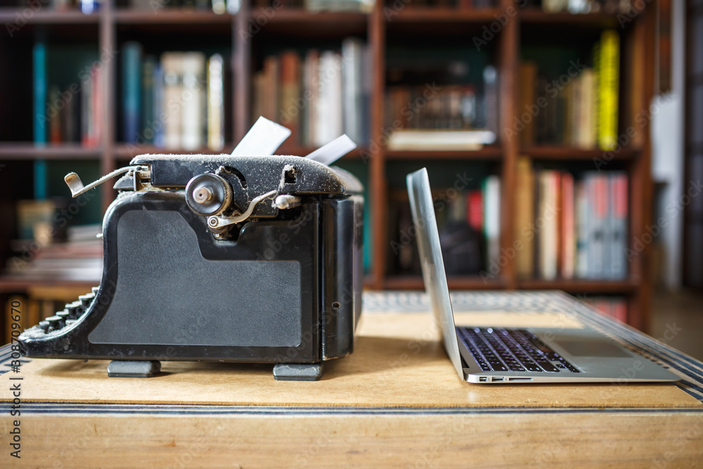 old vintage dust-covered typewriter with sheet of white paper near ...