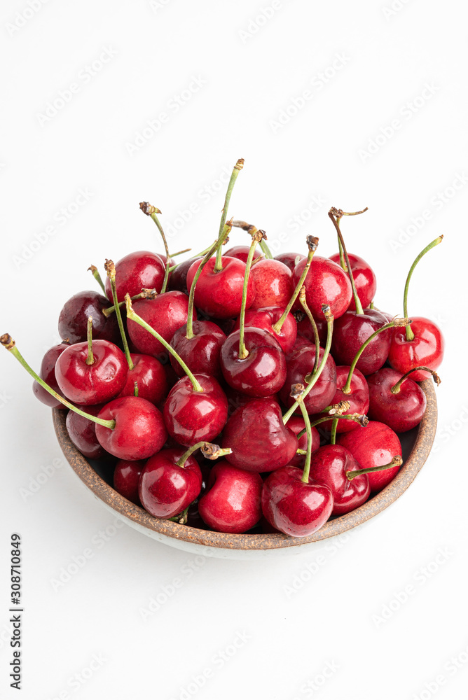 Fresh Red Cherries In A Small Round Stoneware Bowl Fresh Red Cherries In A Small Round Stoneware Bowl