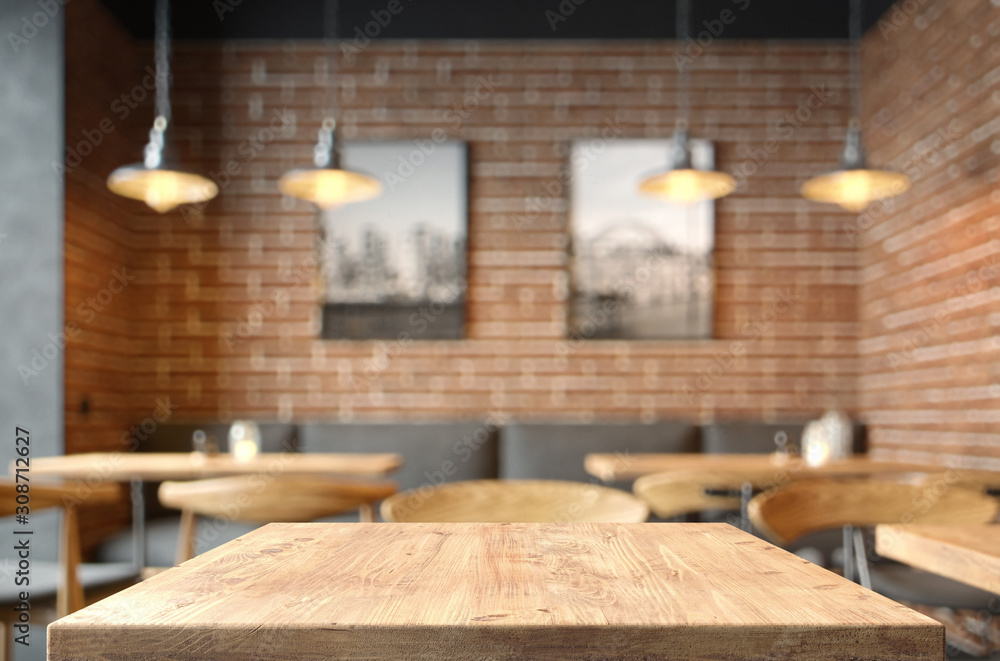 Empty coffee table over defocused coffee shop background with copy space Empty coffee table over defocused coffee shop background with copy space