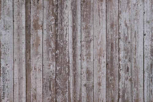 Wooden texture background. Old weathered brown  grey and white wall surface. Vertical wooden boards. Close up with copy space 