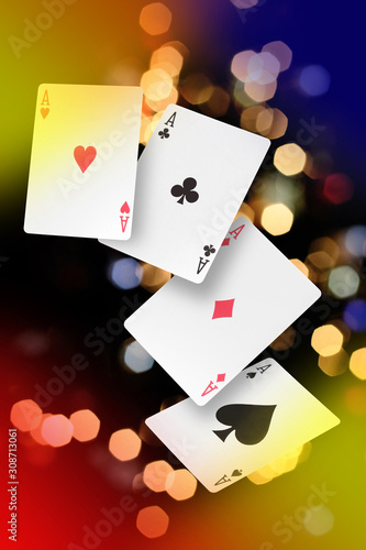 poker of aces on a bokeh lights background with copy space for your text