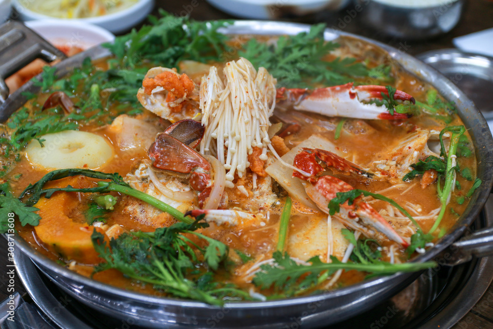 Top view image of korean traditional food, spicy crab stew soup, Kkotgetang,in a big pot Top view image of korean traditional food, spicy crab stew soup, Kkotgetang,in a big pot