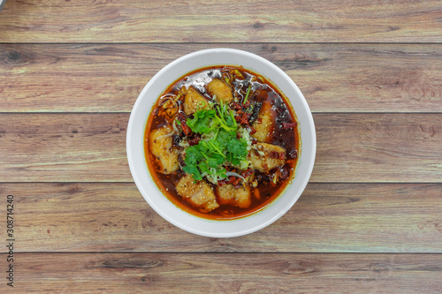 Sichuan spicy boiled fish hot pot with red hot spicy dried chilli & peppercorns. Asia China Chongqing Chengdu authentic food.