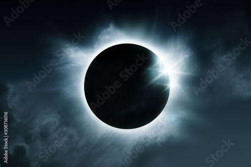 A solar eclipse. The total eclipse is caused when the sun, moon and earth align. Illustration.