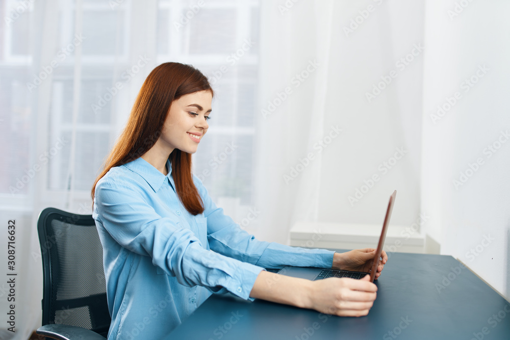 young woman sitting on sofa with digital tablet young woman sitting on sofa with digital tablet