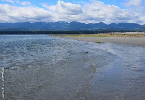 landscape during low tide at Goose Spit Park beach, Comox Vancouver Island, BC Canada; view to the West photo