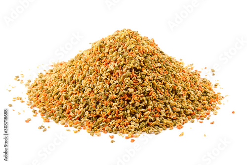 Food for aquarium fish isolated on a white background. Pile of granules to feed tropical aquarium fish. Granule fish food. Food for fish in an aquarium isolated on white.