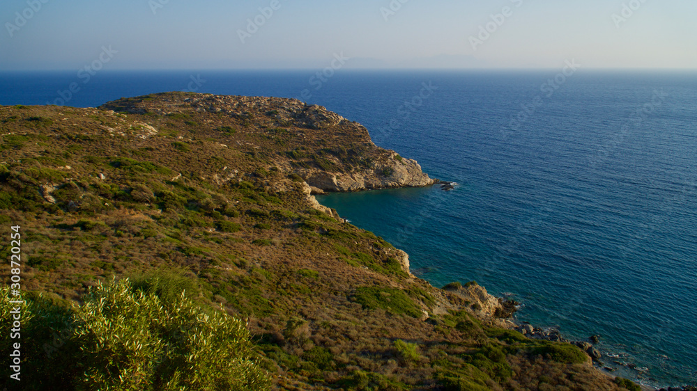 rocky shore blue aegean sea