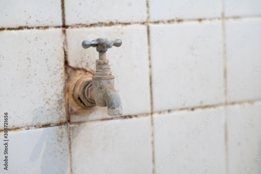 old rusty water tap in the india toilet old rusty water tap in the india toilet