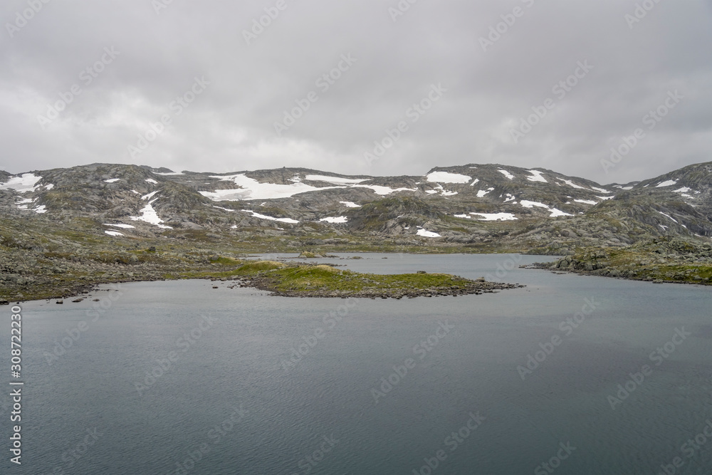 mountain lake in barren mountains, near Finse, Norway