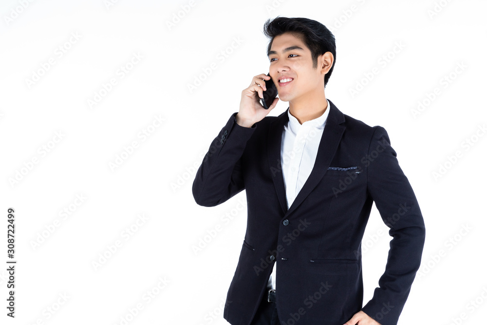 fashion handsome young Asian businessman at smartphone typing message guy isolated on white grey blank copy space studio background,indoor studio shoot fashion handsome young Asian businessman at smartphone typing message guy isolated on white grey blank copy space studio background,indoor studio shoot