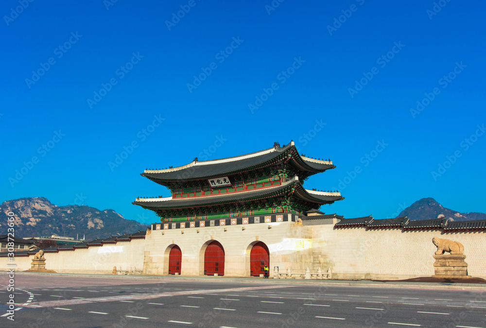 The gate of Gyeongbokgung Palace on blue sky background in Seoul South Korea The gate of Gyeongbokgung Palace on blue sky background in Seoul South Korea