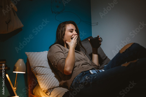 tired woman relaxing in her room