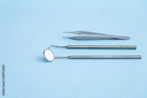 Closeup of dental equipmet laying on blue background photo