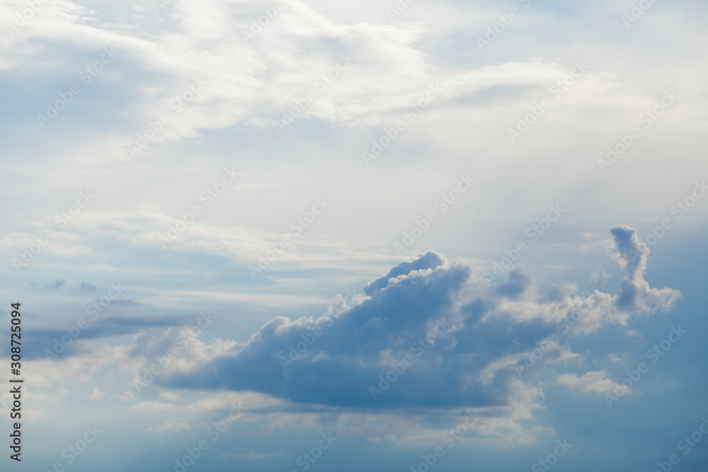 Background of white cumulus clouds on a blue sky at daylight. Telephoto zoom shoot Background of white cumulus clouds on a blue sky at daylight. Telephoto zoom shoot