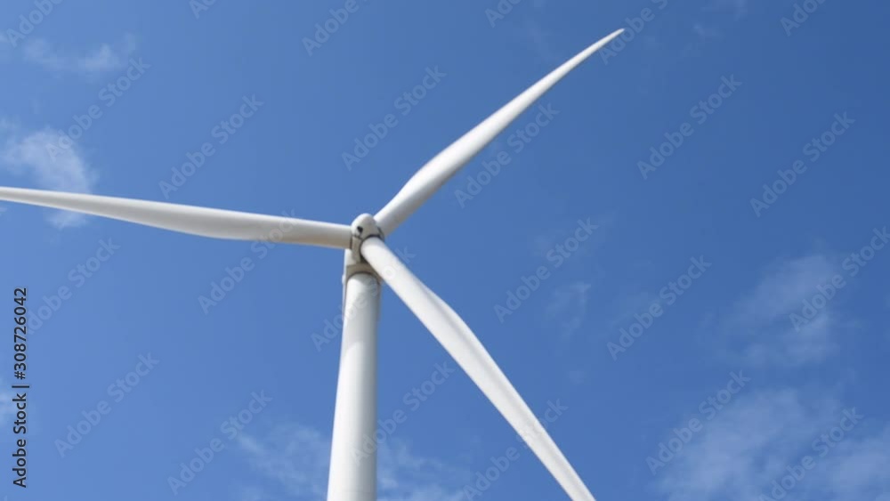 electric clean energy in nature. wind turbine on blue sky background electric clean energy in nature. wind turbine on blue sky background