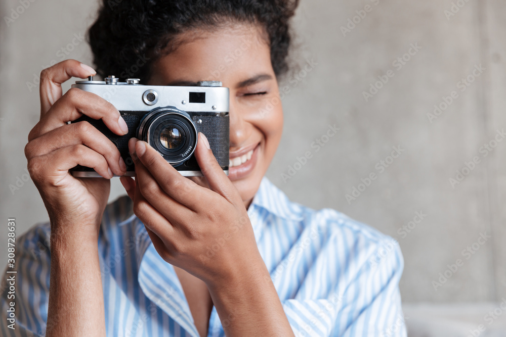 Smiling attractive young african woman wearing shirt Smiling attractive young african woman wearing shirt