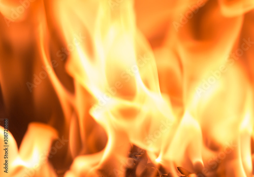 Fire flame burning glowing on black dark background  hot heat energy fuel fire motion pattern abstract texture.