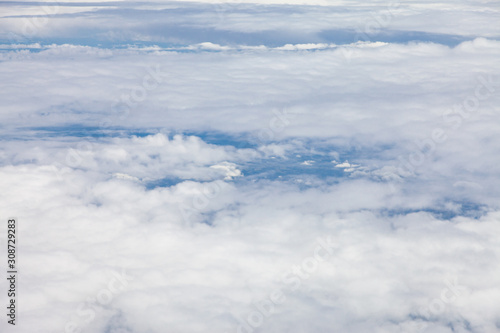Fototapeta Naklejka Na Ścianę i Meble -  Clouds, sky and ground, looking from the plane.