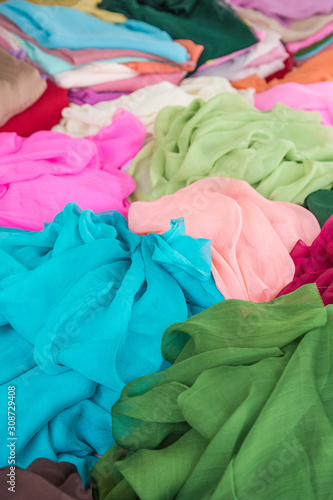 pile of colorful clothes, textiles as a background