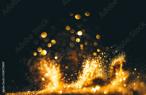 Golden overlay background of golden lights with bokeh effect. Includes copy space
