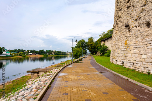 Pskov, the embankment of the Great river near the Pokrovsky fortress tower © oroch2