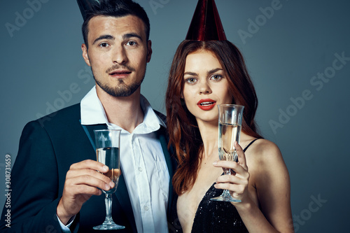 man and woman with glass of red wine