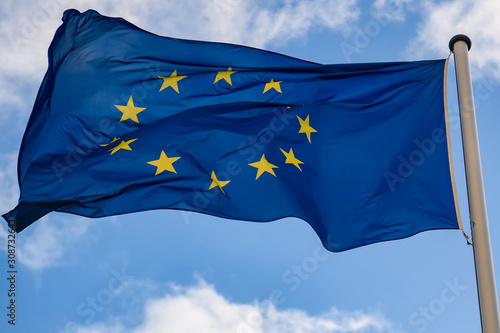  European Union flag against a blue sky.