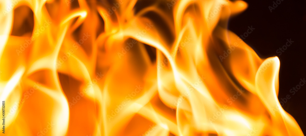Fire flame burning glowing on black dark background, hot heat energy fuel fire motion pattern abstract texture. Fire flame burning glowing on black dark background, hot heat energy fuel fire motion pattern abstract texture.