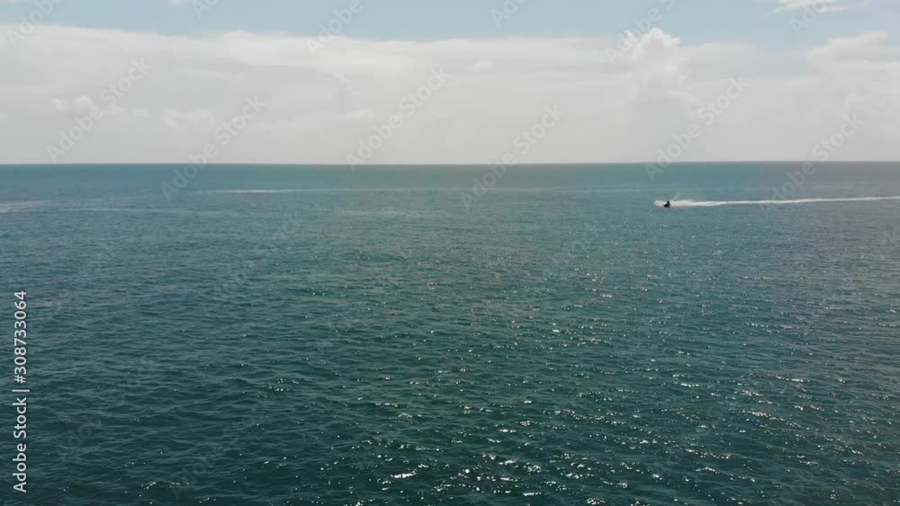 Aerial View Of Jet Ski Racing Across Andaman Sea In The Distance Aerial View Of Jet Ski Racing Across Andaman Sea In The Distance