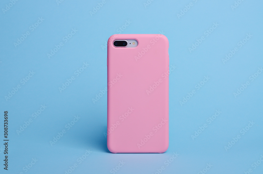 Smart phone on a blue background in a pink plastic case back view. Template of iPhone 8 plus case Smart phone on a blue background in a pink plastic case back view. Template of iPhone 8 plus case