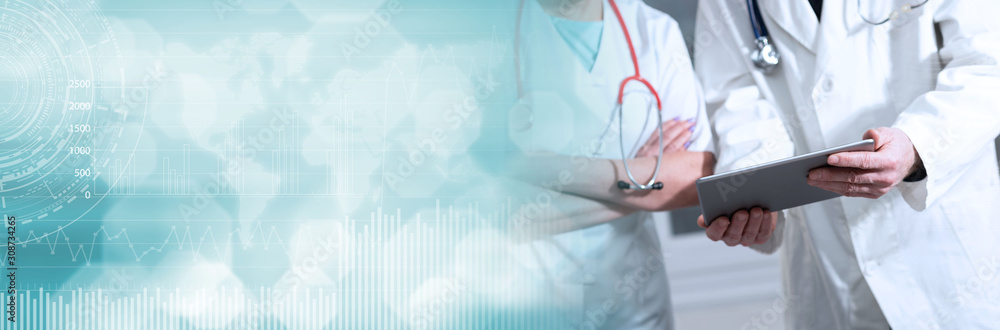 Two doctors discussing about medical report on tablet; panoramic banner Two doctors discussing about medical report on tablet; panoramic banner