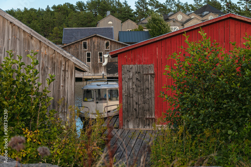 Scandinavian fishing village. Beautiful coastal landscape. Old, beautiful, wooden, textured buildings