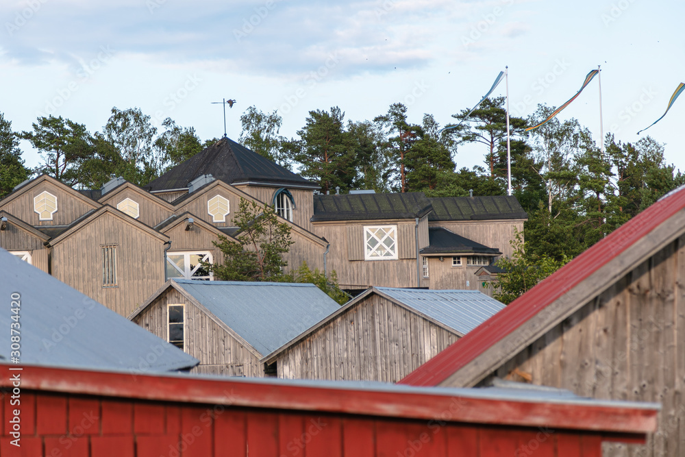 Scandinavian fishing village. Beautiful coastal landscape. Old, beautiful, wooden, textured buildings Scandinavian fishing village. Beautiful coastal landscape. Old, beautiful, wooden, textured buildings