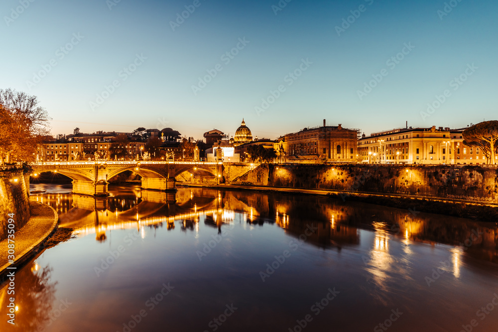 St Peters basilica and river Tibra at night in Rome, Italy
