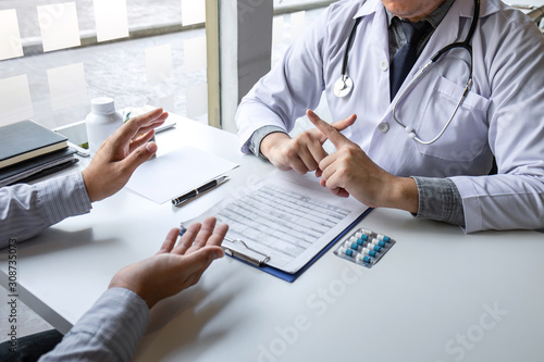 Doctor presenting with patient and checking results on report and prescription about the problem of illness and recommend using medicine, healthcare and medical concept