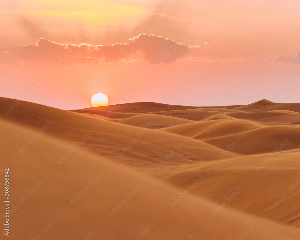 Sunset over the sand dunes in Dubai 