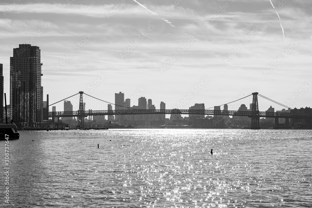 Black and White Photo of the Williamsburg Bridge connecting Manhattan to Brooklyn New York over the East River