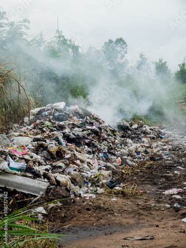 UTHAITANI PROVINCE, THAILAND-NOVEMBER 8 2016, Open Burning of Plastic and organic waste from household in waste landfill.