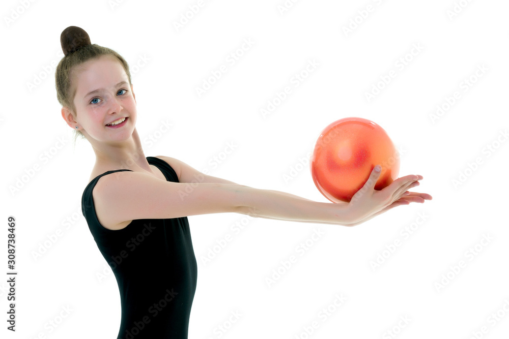 Girl gymnast performs exercises with the ball. Girl gymnast performs exercises with the ball.