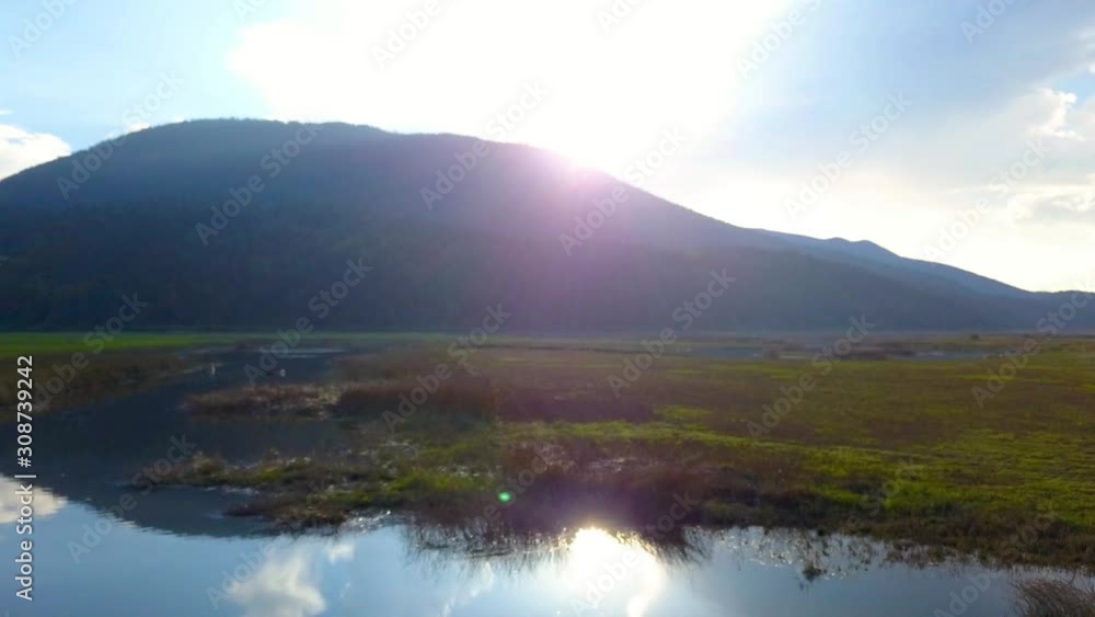 Vertical drone take off and reveal panoramic view of lake Cerknica. Aerial Vertical drone take off and reveal panoramic view of lake Cerknica. Aerial