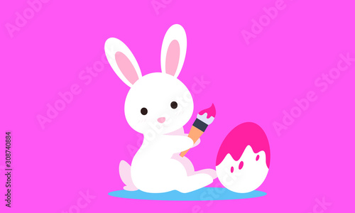 Easter bunny with egg and paint brush © Natalie