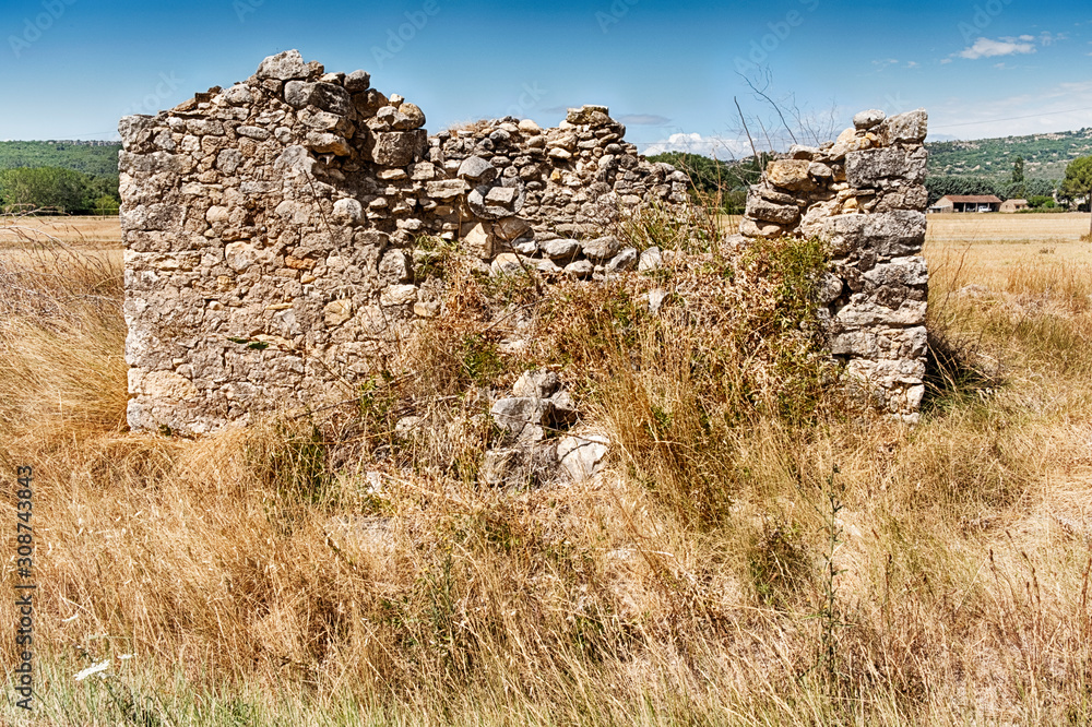 Stone Barn Ruins In A Field