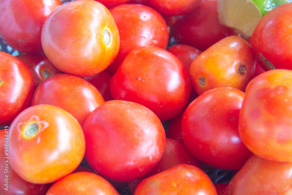 Red tomatoes background. Group of tomatoes . Red tomatoes background. Group of tomatoes .