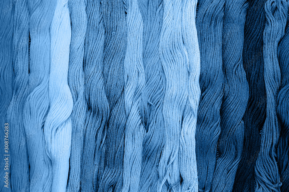 Colorful cotton craft threads in classic blue trendy color. background ...