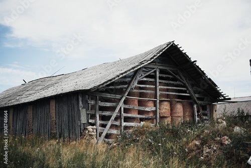 Dry hay stacks in rural wooden barn