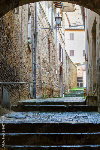 Narrow alley between the old houses