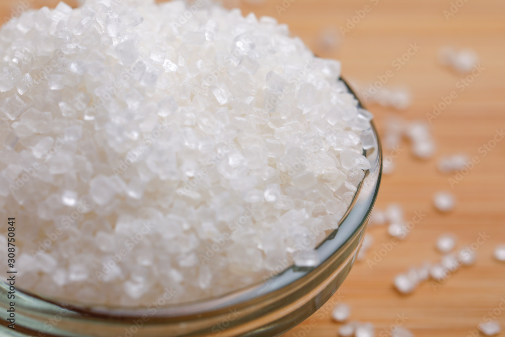 sugar in glass bowl on wooden background sugar in glass bowl on wooden background