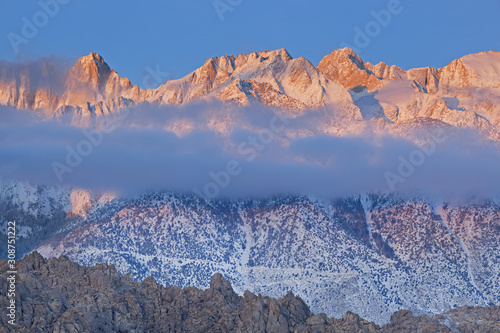 Winter landscape with fog shortly at dawn of Mt. Whitney, Eastern Sierra Nevada Mountains and Alabama Hills near Lone Pine, California, USA